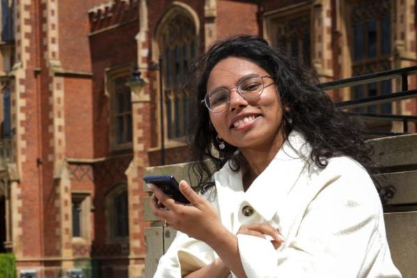 student sat outside Queen's University